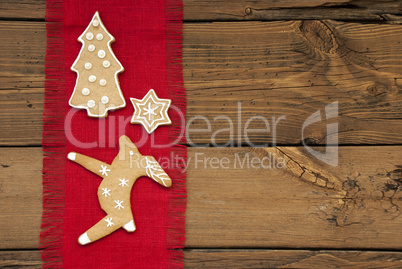 Red Decoration with Ginger Breads on Wood