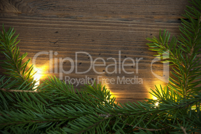 Wooden Background wiht Copy Space, Fir Tree Branches and Fairy Lights