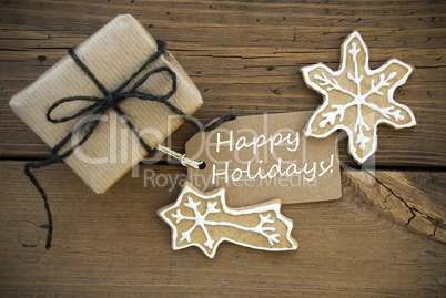 White Happy Holidays on a Banner with Christmas Decoration