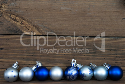 Christmas Balls in a Row on Wood with Copy Space