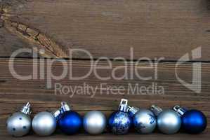 Christmas Balls in a Row on Wood with Copy Space