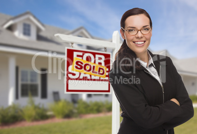 Mixed Race Woman in Front of House and Sold Sign