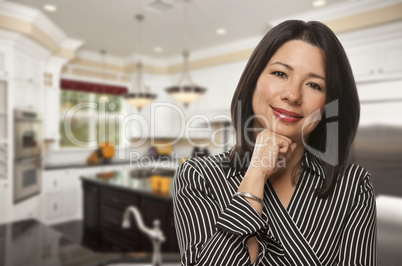 Hispanic Woman Standing in Beautiful Custom Kitchen