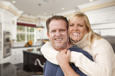 Happy Couple Inside Beautiful Custom Kitchen