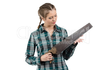 Photo of young woman looking at hand saw