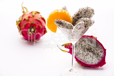 Wedges of the dragon fruit in a glass.