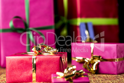 Red Gift Parcel amidst other Presents.