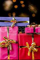 Four Single-Colored Gifts with Golden Bows.