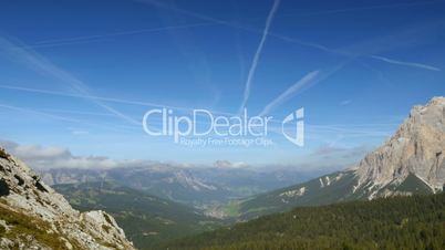 time lapse contrails over dolomites valley 11524