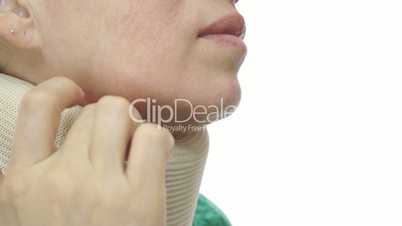 Woman With Neck Brace Scratching Close Up