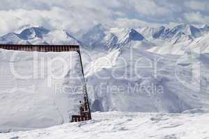 Hotel in snow and ski slope