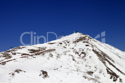 Winter mountains and ski slope in little snow year