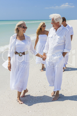 Four People Two Senior Family Couple Walking Tropical Beach