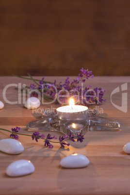 Candle and lavender on wooden Background