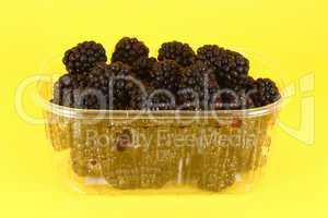 Fresh blackberries in plastic container