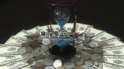 hourglass turns over money