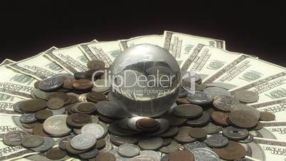 Globe rotates over money