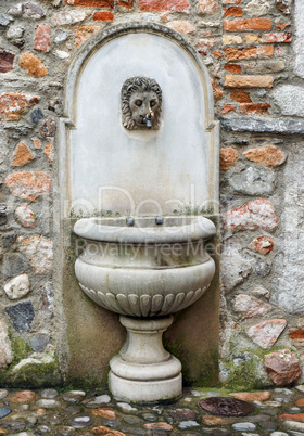 Old Well on Stone Wall