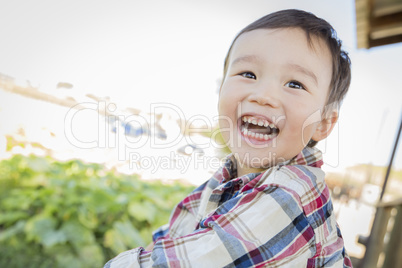 Mixed Race Young Boy Having Fun Outside