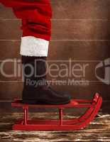 Red sled with the boot of Santa Claus