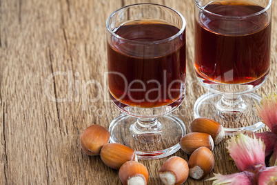 Hazelnut liqueur in two glasses and hazelnuts