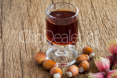 Hazelnut liqueur in a glass and hazelnuts