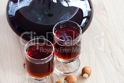 Hazelnut liqueur in two glasses with Hazelnuts