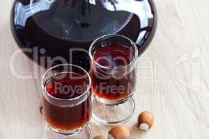 Hazelnut liqueur in two glasses with Hazelnuts