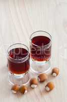 Two glasses with hazelnut liqueur