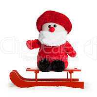 Wooden red sled with Santa Claus plush
