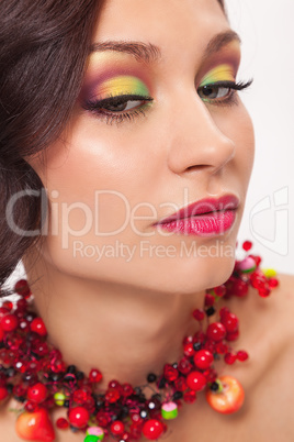 Beautiful young woman with evening make-up in the style of the s