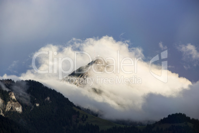 Bavarian mountain Wendelstein with fog in autumn