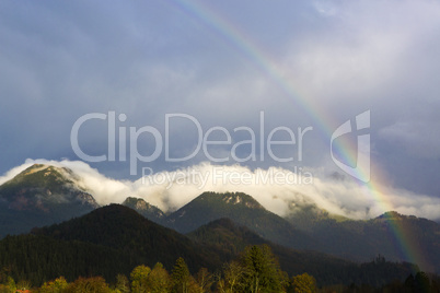 Landscape of Bavarian mountains with rainbow