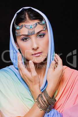 Portrait of young beautiful woman in oriental style