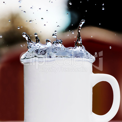 Cup of water running over