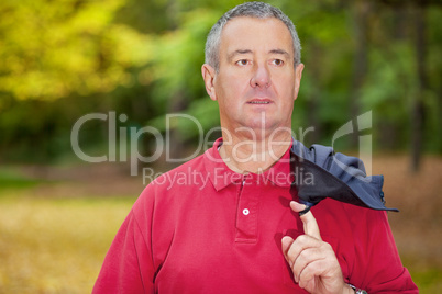 Gray-haired man in the autumn walk