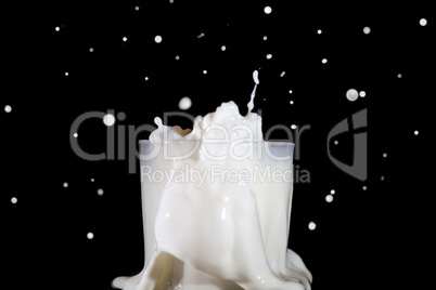 Glass with splashing milk