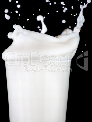 Glass with splashing milk