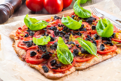 homemade olive - tomato pizza