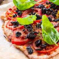 homemade olive - tomato pizza