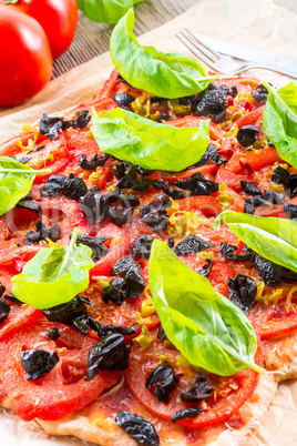 homemade olive - tomato pizza