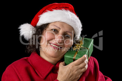 Senior Lady with Santa Claus Hat and Wrapped Gift.