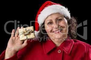 Smiling Old Lady Shows Golden Wrapped Christmas Gift.
