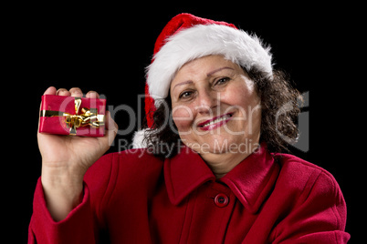 Happy Aged Woman Presenting Red Wrapped Xmas Gift.