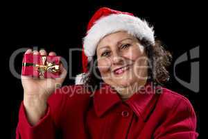 Happy Aged Woman Presenting Red Wrapped Xmas Gift.