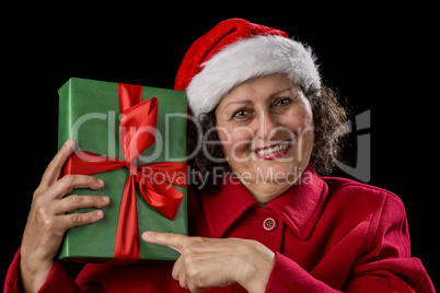 Happy Female Pensioner Pointing at Wrapped Gift.