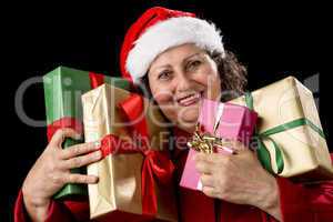 Smiling Aged Woman Embracing Four Wrapped Gifts.