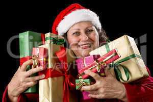 Joyful Senior Woman Hugging Eight Wrapped Gifts.