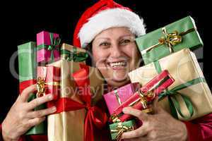 Cheerful Aged Woman Embracing Wrapped Presents .