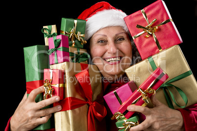 Cheerful Female Senior Embosoming Wrapped Gifts.